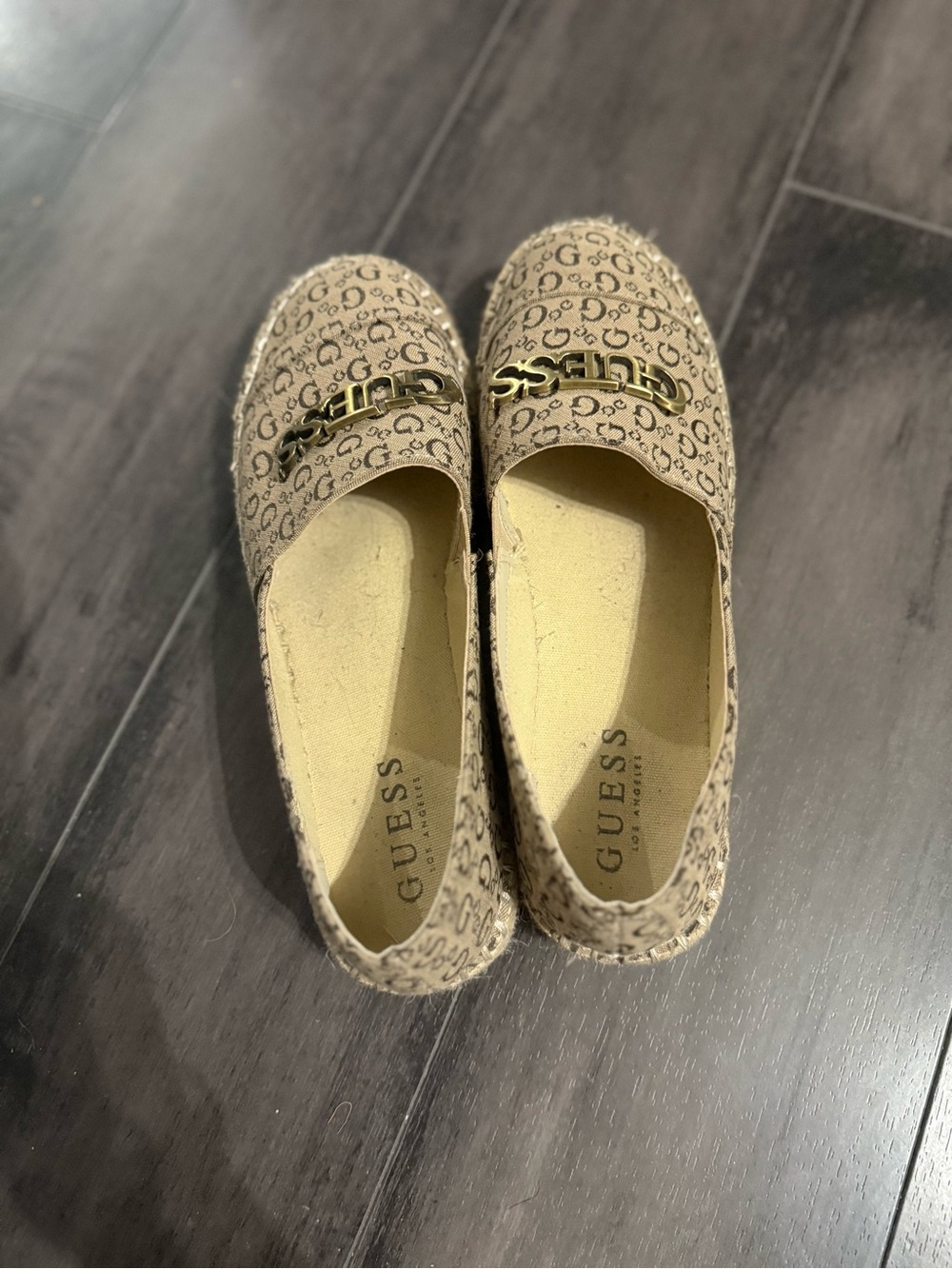 GUESS Beige Logo-Print Slip-Ons with Gold Chain Accent